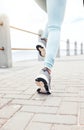 Zoom of runner, sport woman for fitness legs running, training or exercise workout by the sea, beach or ocean. Wellness Royalty Free Stock Photo