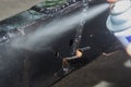 Zoom View Auto Mechanic Spray Paint to Weld at Side of Car Chassis