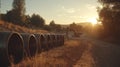 A zoomed-in image of sewer pipe sections being linked in a trench, as sunlight casts shadows across the site and piles Royalty Free Stock Photo