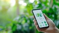 Zoomed-in image of a smartphone displaying an app for tracking personal carbon footprint