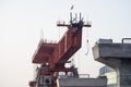 zoomed shot of bridge building machine making an overpass bypass elevated road to ease congested traffic in Indian