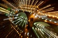 Zoomed shot of a bridge in Chengdu with beautiful light illustrations at nighttime