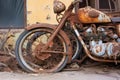 zoomed-in view of a rusted, ancient bike next to vibrant, new bike