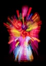 Zooming photo effect in the night with colorful bursts of light red pink orange yellow