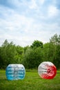 2 Zorbing Balloon on the summer lawn. inflatable zorb ball outdoor. Leisure activity concept with vertical copy space Royalty Free Stock Photo