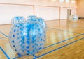 Zorbsoccer. Equipment for team building sport game named bumper ball or bubble ball. Blue bumper boll bubble balloons in Royalty Free Stock Photo