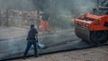 workers at work to redo the road surface