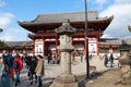 Stone lantern in front of the second antique wooden archway entrance of Todaiji temple.