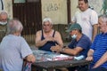 Older gentlemen play cards