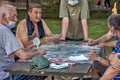 Older gentlemen play cards