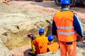 Boss oversees, control work on construction site