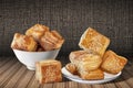 Bunch Of Freshly Baked Zuzu Square Sesame Puff Croissant Pastry Set On Rustic Bamboo Place Mat