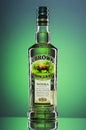 Zubrowka grass flavored vodka on breen gradient background.