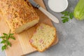 Zucchini bread with cheese, ham and fresh herbs on a wooden board on a gray background. Healthy food Royalty Free Stock Photo