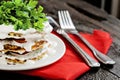 Zucchini cake and eating utensils on a red napkin Royalty Free Stock Photo