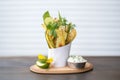 zucchini chips in a paper cone stand