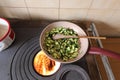 zucchini cooked in a pan on a wood stove