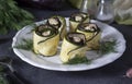 Zucchini and eggplant rolls with garlic and cream cheese on a plate on gray background Royalty Free Stock Photo