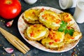 Zucchini fritters with sour cream, tomatoes and cheese