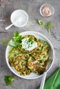 Zucchini fritters, vegetarian zucchini pancakes, served with fr