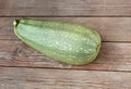 Zucchini or green courgette on a wooden Royalty Free Stock Photo