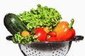 Zucchini, lettuce, bell pepper and tomatoes in a colander. Royalty Free Stock Photo