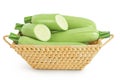 zucchini or marrow in a wicker basket isolated on white background with full depth of field Royalty Free Stock Photo