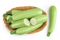 zucchini or marrow in a wicker basket isolated on white background with full depth of field. Top view. Flat lay Royalty Free Stock Photo