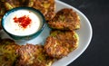 Zucchini meal with pumpkin on white plate with yogurt turkish mucver