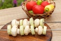 Zucchini and mushrooms on metal skewers on wooden chopping board Royalty Free Stock Photo