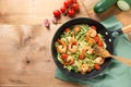 Zucchini noodles with cherry tomato and prawns in a pan Royalty Free Stock Photo