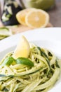 Zucchini noodles with pesto sauce on wooden background Royalty Free Stock Photo