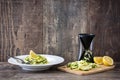 Zucchini noodles with pesto sauce on wooden table Royalty Free Stock Photo