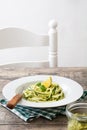 Zucchini noodles with pesto sauce on wooden table Royalty Free Stock Photo