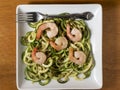 zucchini noodles with pesto and sauteed onions