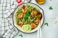 Zucchini pasta with pesto sauce and grilled shrimp in pan. Food recipe background. Close up Royalty Free Stock Photo