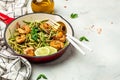 Zucchini pasta with shrimps and pesto sauce in pan. keto low carb diet. banner, menu, recipe place for text, top view Royalty Free Stock Photo