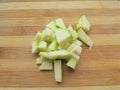 Zucchini pieces heap on wooden background Royalty Free Stock Photo