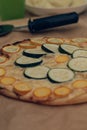 Zucchini pizza topped with green and yellow zucchinis