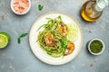 Zucchini raw pasta with pesto sauce and grilled shrimp cheese Parmesan, Restaurant menu, dieting, cookbook recipe top view Royalty Free Stock Photo