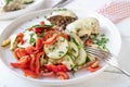 Zucchini salad with tomatoes and bell peppers marinated with olive oil, honey, vinegar and herbs Royalty Free Stock Photo