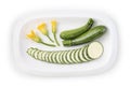 zucchini sliced and flowers on dish food top view isolated on white background