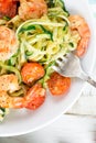 Zucchini spaghetti with cherry tomato and prawns close up Royalty Free Stock Photo