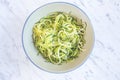 Zucchini spaghetti or noodles & x28;zoodles& x29; in a bowl with marble ba Royalty Free Stock Photo