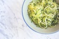 Zucchini spaghetti or noodles & x28;zoodles& x29; in a bowl with marble ba Royalty Free Stock Photo