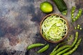 Zucchini spaghetti or noodles zoodles bowl with green veggies. Top view, overhead, copy space. Royalty Free Stock Photo