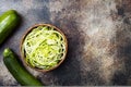 Zucchini spaghetti or noodles zoodles bowl with green veggies. Top view, overhead, copy space. Royalty Free Stock Photo