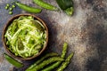 Zucchini spaghetti or noodles zoodles bowl with green veggies. Top view, overhead, copy space. Royalty Free Stock Photo