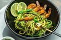 zucchini spaghetti Pasta with basil pesto sauce and grilled shrimp, Vegetarian healthy food, place for text, top view Royalty Free Stock Photo