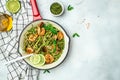 Zucchini spaghetti with pesto sauce and grilled shrimp skewers in pan. keto low carb diet. banner, menu, recipe place for text, Royalty Free Stock Photo